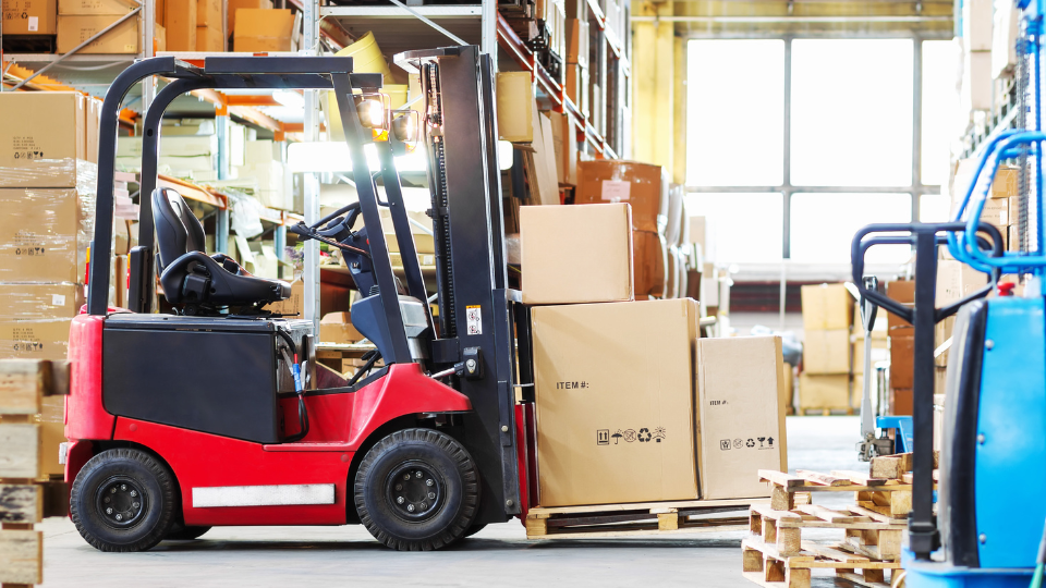 Large boxes being lifted by a forklift, costing Walmart sellers extra fees